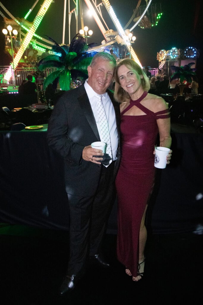 George and Jen Long at the 2026 Krewe of Priscus Coachella in Pensacola, Florida