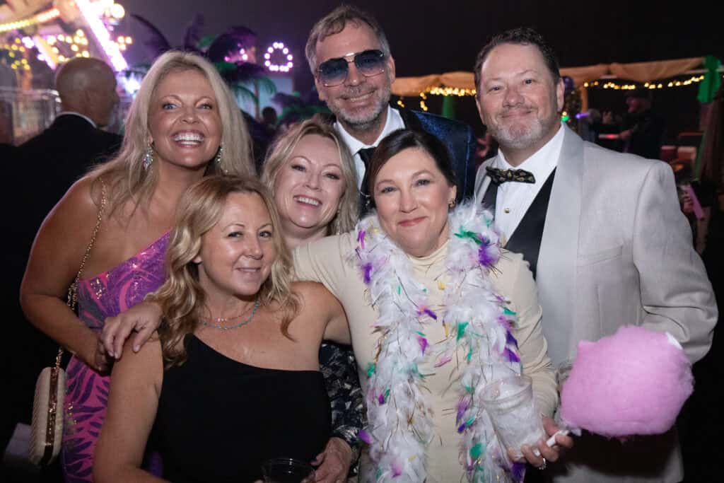 Joe and Dee McCoy, Paul and Melissa Leanzk, and Emily Peters at the 2026 Krewe of Priscus Coachella in Pensacola, Florida