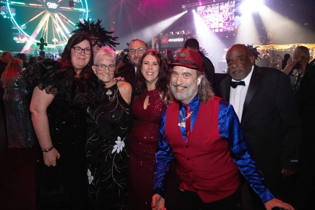 Stephanie and Rod Villuvs, Bridget Hargsleben, Dawn and Chad Paulus, and J.C. McEwen at the 2026 Krewe of Priscus Coachella in Pensacola, Florida