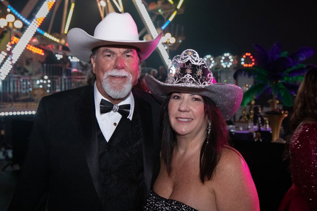 Delisa and Eric Daniels at the 2026 Krewe of Priscus Coachella in Pensacola, Florida