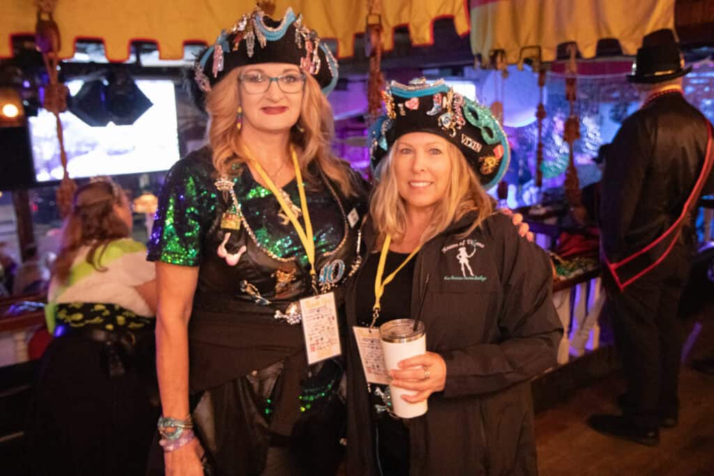 Angela Pheiffer and Deb Ballia at the 2026 Mardi Gras Kick-off in the Seville Quarter of Pensacola, Florida
