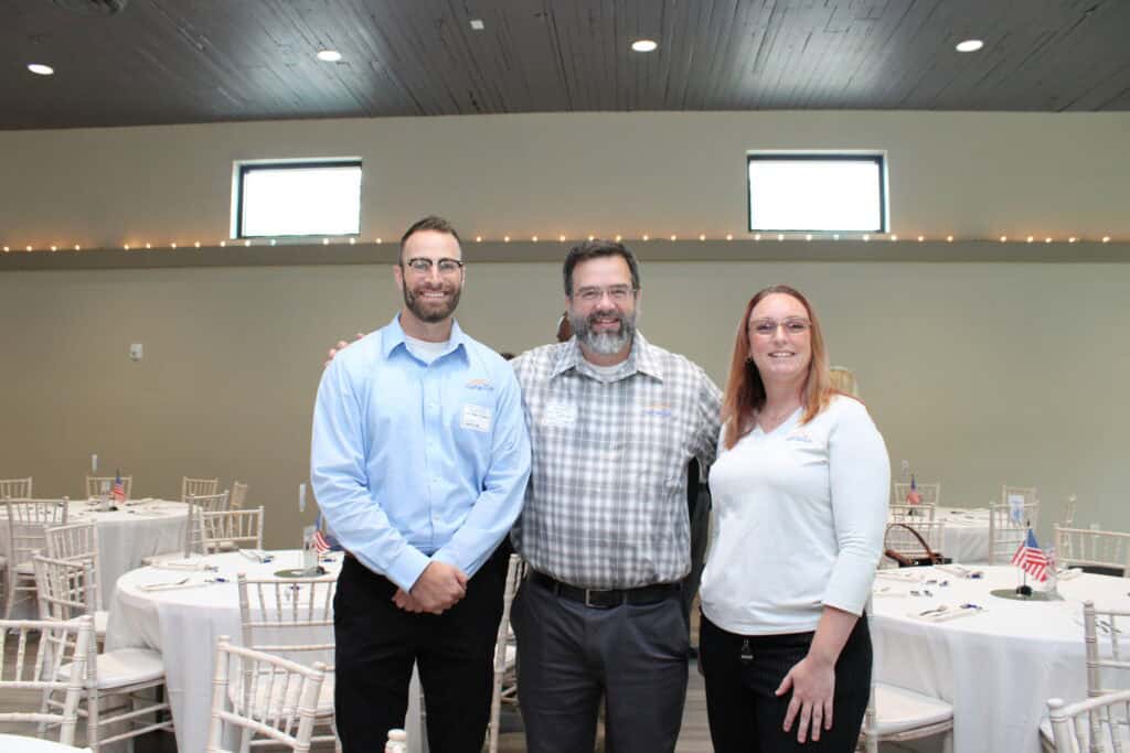 Chris Tenney, Walt Stepnowski & Jessica Stefanko at the 2026 State of the Military Luncheon in Pensacola, FL.